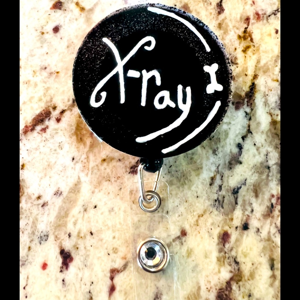 Black, glitter, and diamond x-ray circle badge reel. Badge pull. X-ray.